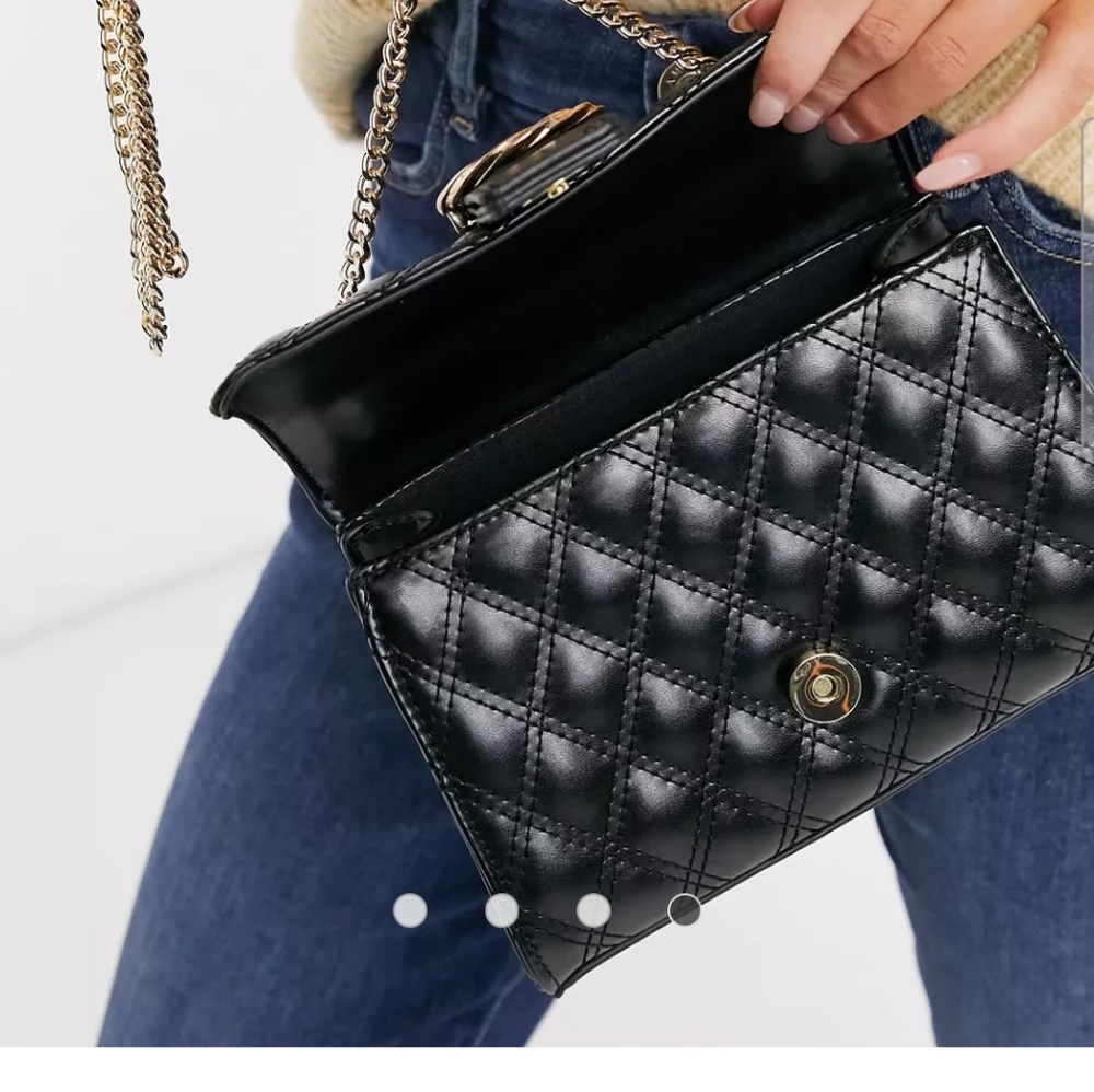 Asos Crossbody bag with twisted buckle in black quilt